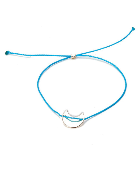 teal string bracelet with charm
