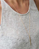 Gold and Gray Small Gold Spike Necklace Worn 